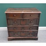 A Charles II oak chest of two short and three long geometric moulded drawers, on bracket feet,