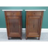 A pair of early 20th century mahogany marble top bedside tables,