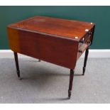 In the manner of Gillows; a George IV mahogany Pembroke table, with fitted frieze drawer,