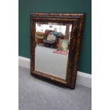 Muirhead Moffat & Co Glasgow; a Dutch style faux tortoiseshell veneered rectangular wall mirror,
