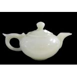 A Chinese reconstituted jade teapot and cover, 20th century, of compressed globular form,