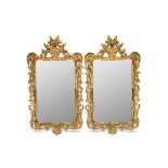 A pair of George III style gilt framed mirrors,