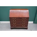 A George III mahogany bureau with fitted interior over four long graduated drawers, on bracket feet,