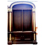 A large pair of Regency design parcel gilt mahogany domed top bookcase cupboards,