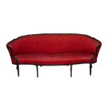 A George III mahogany framed tub back sofa, with serpentine seat on tapering reeded supports,