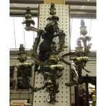 A pair of Louis XVI style gilt and patinated bronze six branch wall lights,