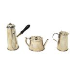 Three late Victorian silver novelty pepperettes, comprising; a miniature oval teapot, Chester 1896,