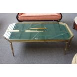 A mid 20th century lacquered brass coffee table,