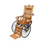 An early 20th century wicker bath chair with leaf suspension seat and spoke wheels,