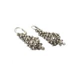 A pair of diamond set girandole pendant earrings, each of tapered form,
