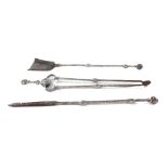 A set of Victorian steel fire irons with double knopped plain stem and spherical pommel,