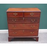 A George III inlaid mahogany chest of two short and three long graduated drawers, on bracket feet,