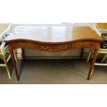 A George III inlaid mahogany serpentine serving table, with three frieze drawers,