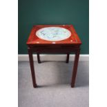 A 20th century Chinese square hardwood table, inset with a ceramic disc, on square supports,