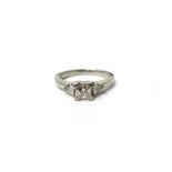 A platinum and diamond three stone ring,