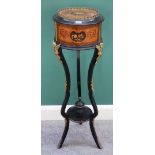 A 19th century French gilt metal mounted ebonised and marquetry inlaid circular jardiniere on three