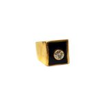 A gold, diamond and black onyx set signet style ring,