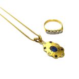 A gold, sapphire and diamond set shaped oval pendant,