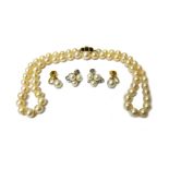 A single row necklace of slightly graduated cultured pearls,