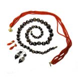 A single row necklace of graduated banded agate beads, length 65cm,