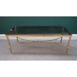 A 20th century rectangular lacquered brass coffee table, with 'X' frame stretcher,