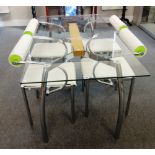 20th century design; a rectangular glass top dining table on four chrome supports,