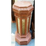 A Victorian terracotta octagonal jardiniere with relief moulded body, 43cm wide x 95cm high.