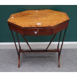 A Regency crossbanded mahogany lift top work table of compressed octagonal form, on turned supports,