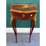 A late 19th century French gilt metal mounted Vernis Martin decorated lift top side table of