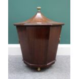 A George III style mahogany cellarette, of flared octagonal form, 44cm wide x 50cm high.