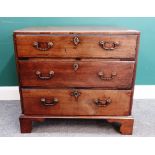 A mid-18th century small mahogany chest of three long graduated drawers on bracket feet,