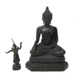 A bronze figure of Buddha, seated in dhyanasana with hands in bhumisparsa and dhyana mudra,