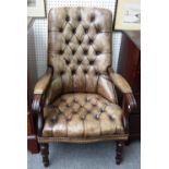A Regency style green leather upholstered mahogany framed open arm library chair,