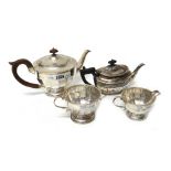 Silver, comprising; a teapot of circular form, the body with faceted decoration,