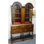 An 18th century style Dutch oak double domed top display cabinet/chest,