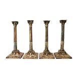 A set of four George III silver table candlesticks,