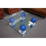 Maville Interiors, France; a 20th century square glass top coffee table,