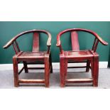 A pair of 19th century Chinese red painted softwood horseshoe back chairs, on block supports,