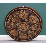 A 20th century circular resin table top decorated with fish, 91cm diameter.