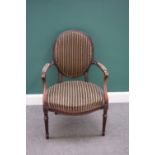 A Hepplewhite style stained beech semi-padded open armchair, on fluted supports,