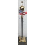 A Victorian style brass and ebonised adjustable standard lamp (converted),