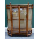 An Aesthetic Movement bobbin turned oak hanging two door display cabinet with glazed rounded