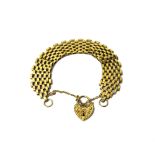 A 9ct gold wide oval link bracelet, on a 9ct gold heart shaped padlock clasp,