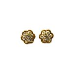 A pair of 9ct gold and diamond seven stone cluster earstuds, claw set with circular cut diamonds,