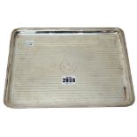 A silver plain rectangular dressing table tray, decorated with finely reeded bands,