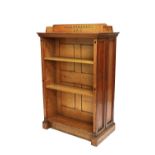 A Victorian oak floor standing double sided bookcase on plinth base,