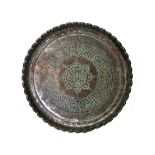 An Egyptian large tinned copper dish, 18th century, with scalloped rim,