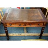 An early Victorian mahogany two drawer writing table, on turned supports, 106cm wide x 73cm high.