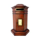 A Victorian style yew wood octagonal table top post box, on plinth base, 23cm wide x 39cm high.