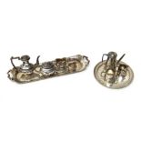 Silver, comprising; a miniature four piece tea and coffee set, with partly fluted decoration,